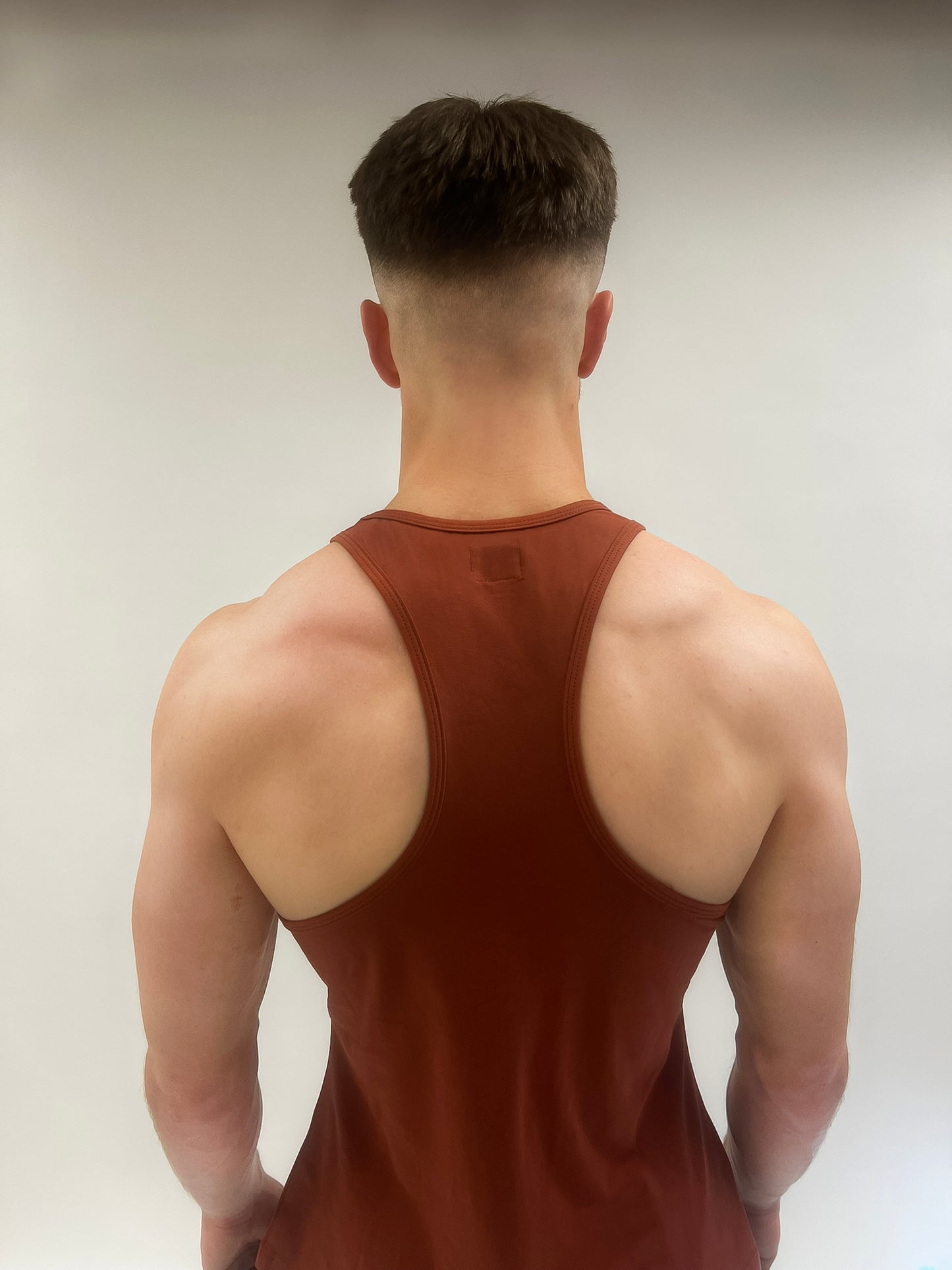 Back view of the Invicta Crimson Premium Fitted Gym Vest in maroon.
