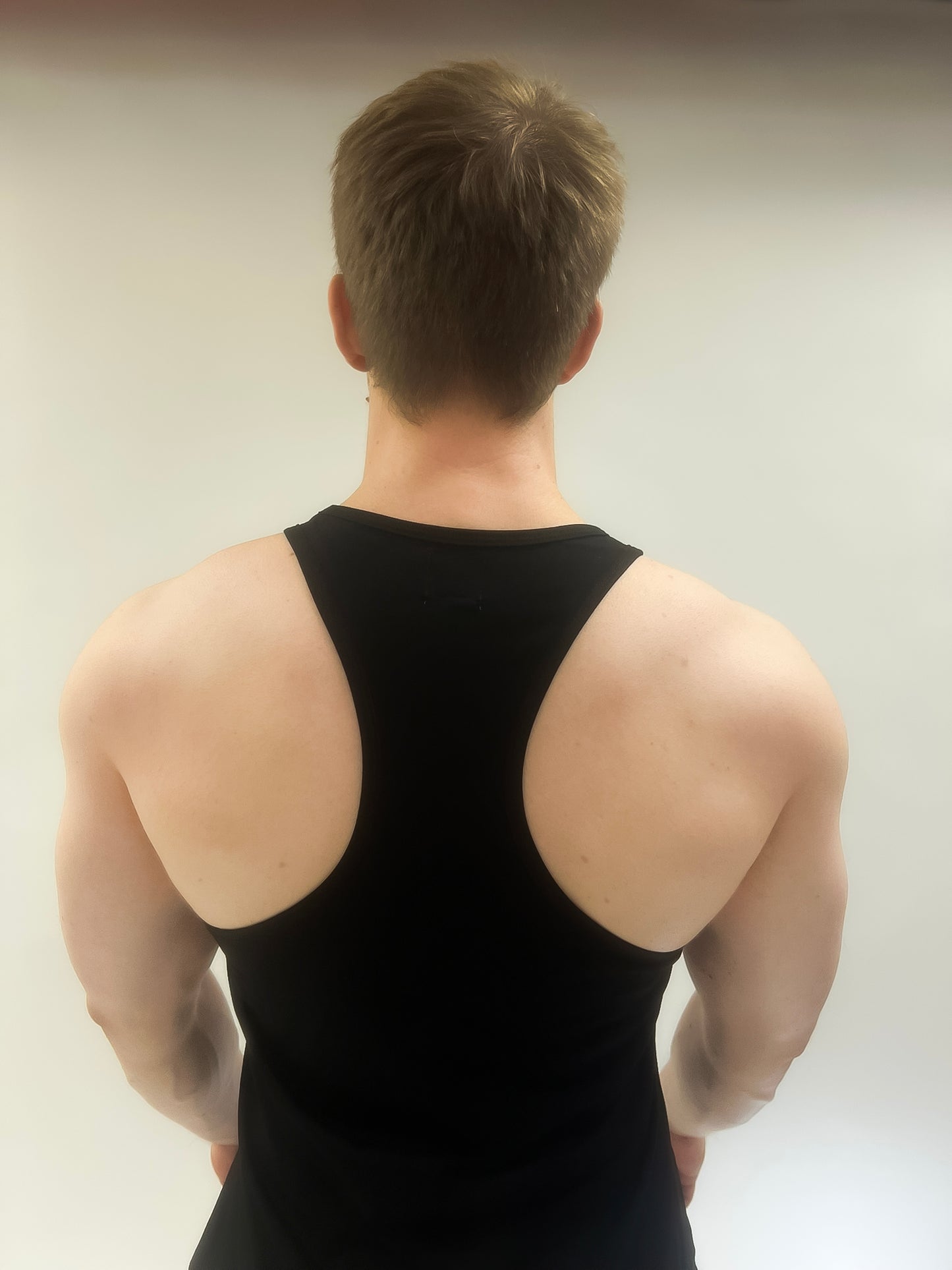 Back view of the Invicta Inverse Premium Fitted Gym Vest in black.